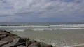 People enjoy sunny beach and ocean at Portimao skyline Portugal 4k or 4k+ Resolution