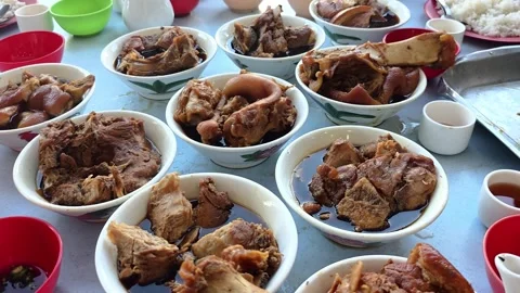 People enjoying authentic and original Klang bak kut teh served in multiple Stock Footage 342796397