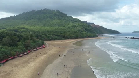 People enjoying the beach in java, indonesia aerial view Stock Footage 328920398