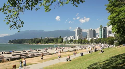 People enjoying First Beach / Sunset Beach  in Vancouver British Columbia Stock Footage