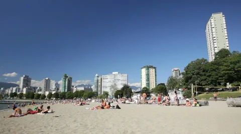 People enjoying First Beach / Sunset Beach 2 HD Stock Footage