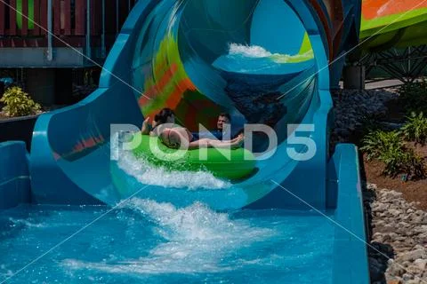 People enjoying Karekare curl at Aquatica 33 Stock Photos