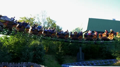 People enjoying Max And Moritz family rollercoaster in Efteling amusementpark. Stock Footage 287942264