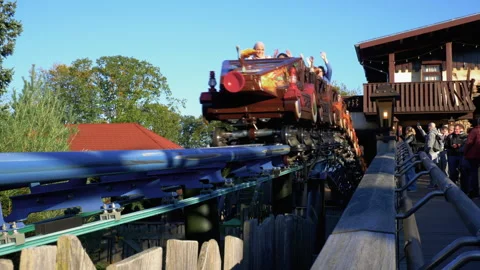 People enjoying Max And Moritz family rollercoaster in Efteling amusementpark. Stock Footage 287942610