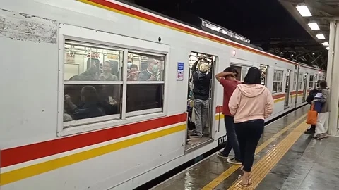 People enter the commuterline train Stock Footage 225258291