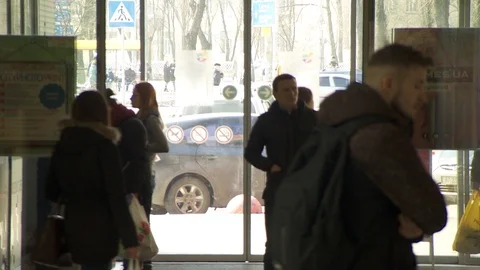 People enter the mall through sliding doors. Stock Footage 113566301