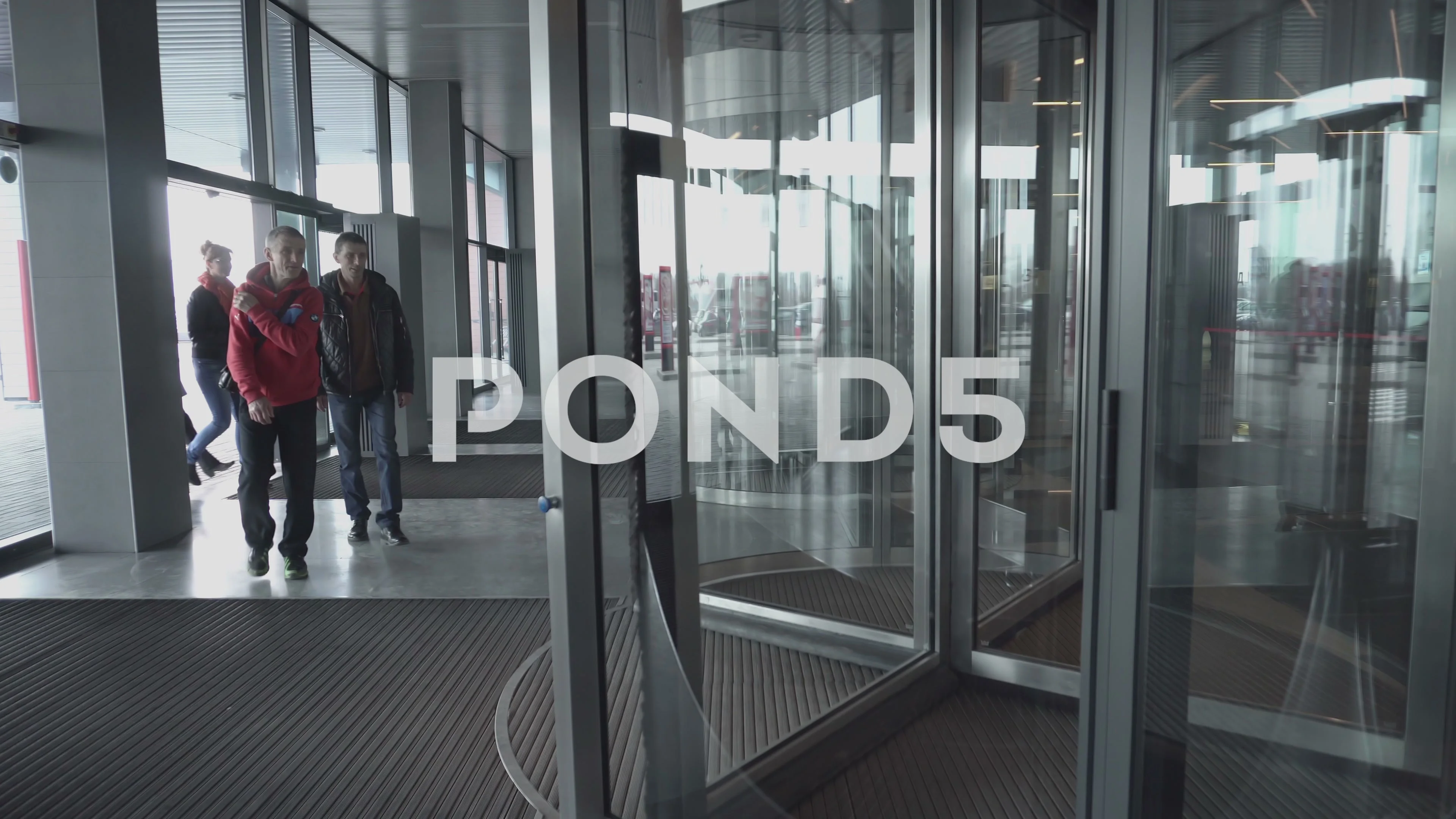People Enter Into The Rotating Spinning Revolving Glass Doors People Enter Into The Rotating Spinning Revolving Glass Doors 62782315