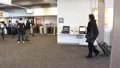 People Entering Airport Terminal HD Footage