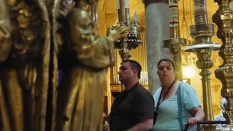 People entering into Jesus Empty tomb in Jerusalem Stock Footage