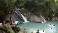 People in Erawan National Park and Erawan Waterfall in western Thailand HD Footage