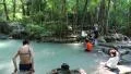 People in Erawan National Park and Erawan Waterfall in western Thailand HD Footage