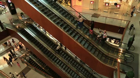 People on an escalator in a mall Stock Footage 45733014