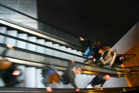 People on escalator Stock Photos
