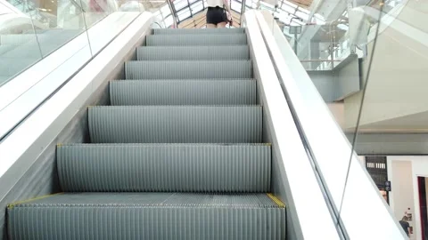 People on escalators in the mall Stock Footage 136320703