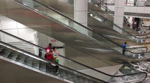 People on escalators in subway station Stock Footage 24864096