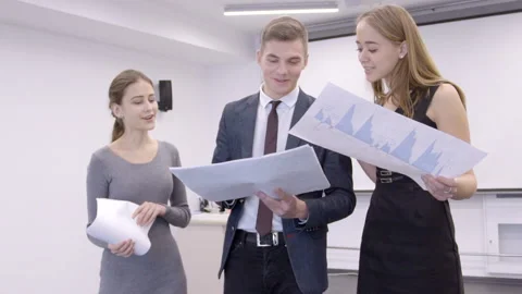 People evaluate positive results of work on charts in office of crypto currency. Stock Footage 85712221