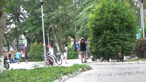 People exercise and play hacky sack in the park Stock Footage 333105856