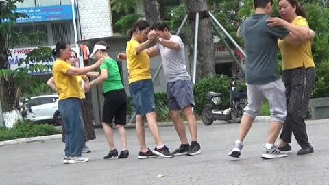 People exercise and play hacky sack in the park Stock Footage 333105921