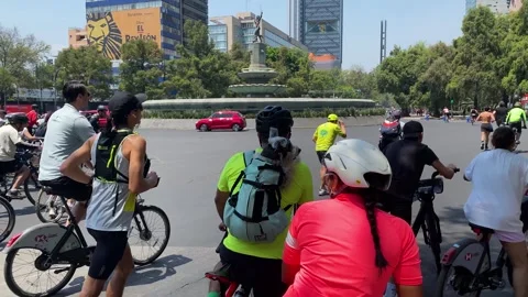 People exercise during a sunny weekend in Reforma avenue, Mexico City 4K Stock Footage 308749437