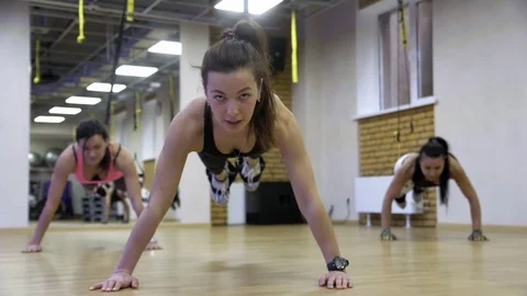 People exercise at a gym by using bungee training Stock Footage 73484297