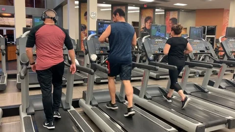 People Exercise on Treadmill Walking Workout Stock Footage 120654819