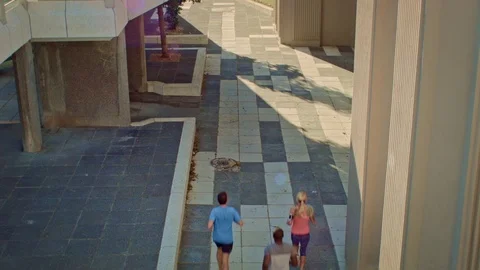 People exercising running under bridge structure Video stock 71626059