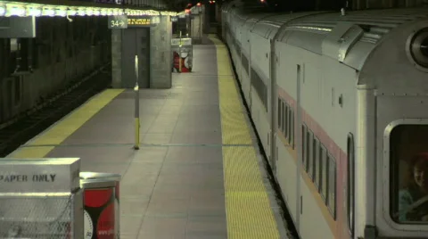 People exit commuter train Stock Footage