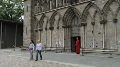 People exit from the Nidaros cathedral in Trondheim, Norway. Video stock 59663241