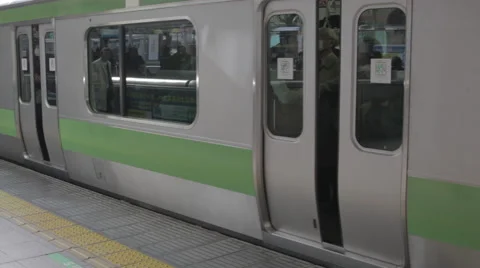 People Exit Train in Japanese Train Station Stock Footage 52626849