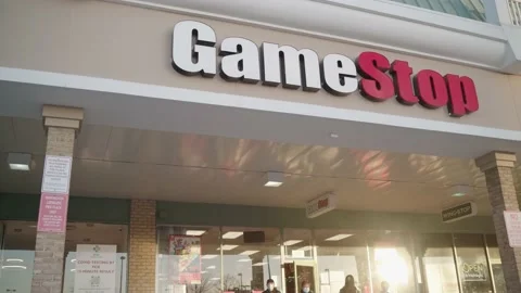 People exiting Gamestop Stockbeeldmateriaal 147564681