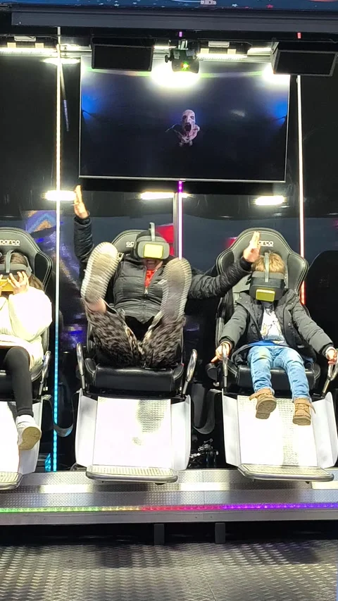 People experience the 3D Motion Simulators in the Malieveld Fair in The Hague Stock Footage 336976202