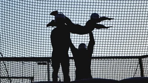 People experiencing skydiving thrills in a vertical wind tunnel with an Stock Photos