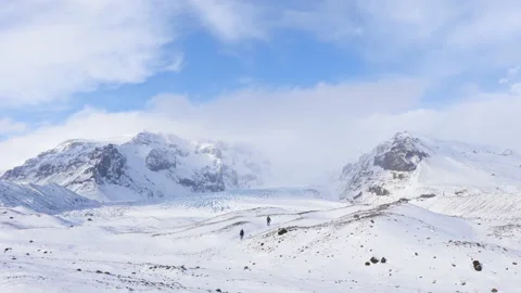 People Exploring Snowy Glacier Landscape in Iceland Stock Footage 172117464