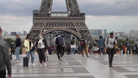 People with face masks Eiffel Tower Paris, Covid-19 coronavirus tourism Europe Stock Footage 139715197