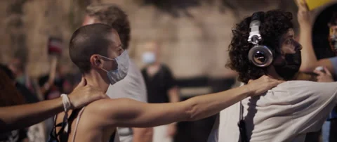 People in face masks protesting Stock Footage 152848037