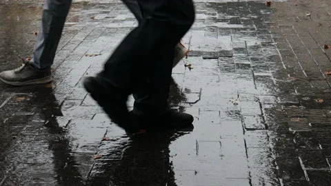 People feet in boots walk in the rain. H... | Stock Video | Pond5