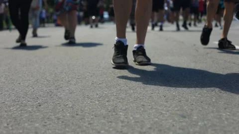 People feet while walking on road in protest Stock Footage 140355986