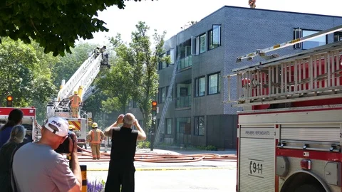 People filming fire scene Stock Footage 114805593