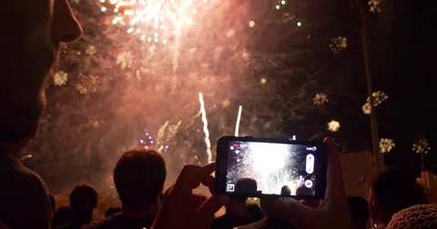 People filming Fireworks display big finale USA 4th of July New Year Celebration Stock Footage