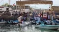 People at fish market in Dibba Al-Baya harbor, Sultanate of Oman HD Footage