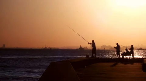 People fishing in sunset Stock Footage 68993653
