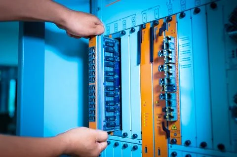 People fix core switch in network room Stock Photos