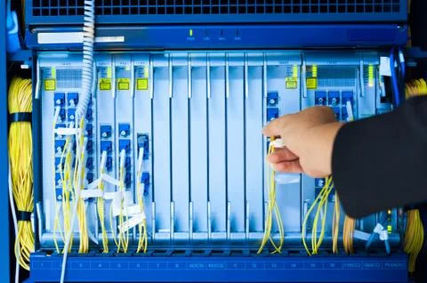 People fix core switch in network room Stock Photos