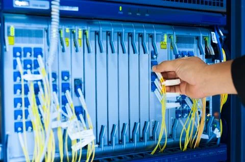 People fix core switch in network room Stock Photos