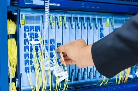 People fix core switch in network room Stock Photos