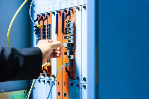 People fix core switch in network room Stock Photos