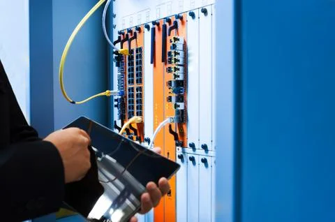 People fix core switch in network room Stock Photos