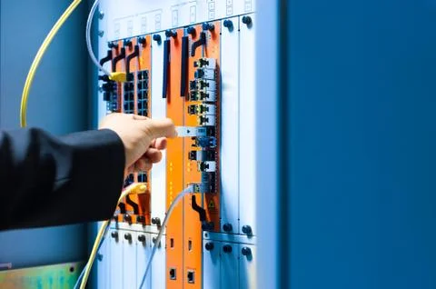 People fix core switch in network room Stock Photos