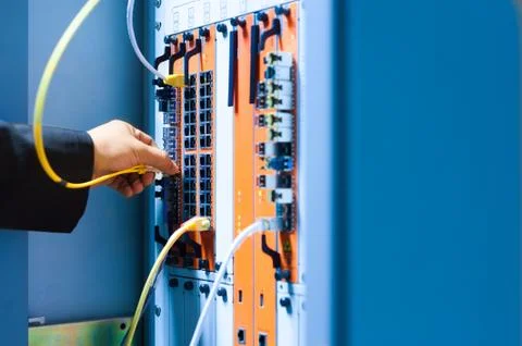 People fix core switch in network room Stock Photos