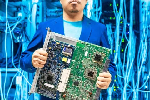 People fix core switch in network room Stock Photos